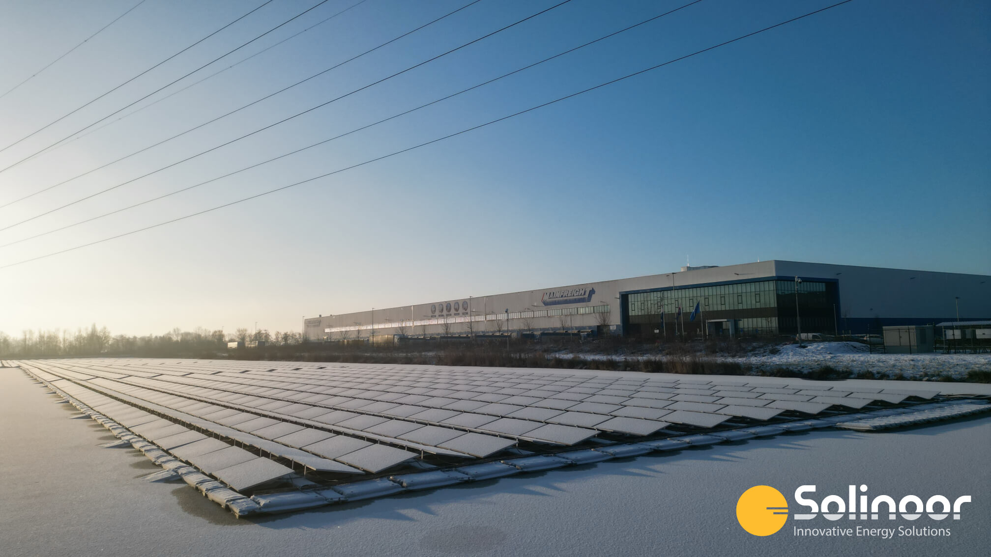 Floating solar park Zaltbommel in the winter with snow and ice